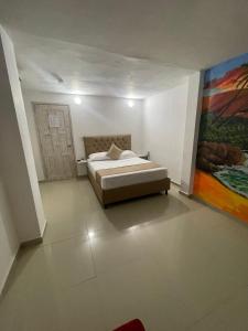 Postel nebo postele na pokoji v ubytování Hotel Hernández CTG