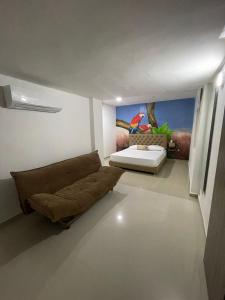 Postel nebo postele na pokoji v ubytování Hotel Hernández CTG
