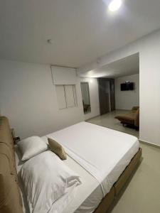Postel nebo postele na pokoji v ubytování Hotel Hernández CTG