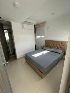 Postel nebo postele na pokoji v ubytování Hotel Hernández CTG