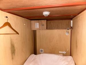 Letto o letti in una camera di WGJ Hostel