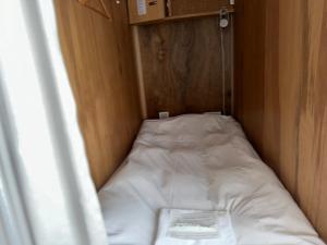 Letto o letti in una camera di WGJ Hostel