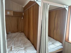Letto o letti in una camera di WGJ Hostel