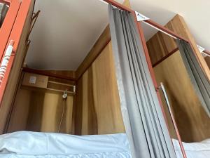 Letto o letti in una camera di WGJ Hostel