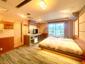 Krevet ili kreveti u jedinici u objektu 富士Outlet温泉Hotel