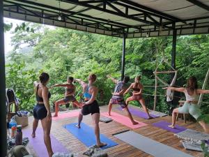 a group of people in a yoga class at Villa Gaspar Terrazas in Playa hermosa