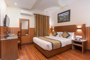 Letto o letti in una camera di Oasis Kathmandu Hotel