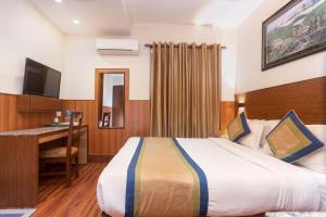 Letto o letti in una camera di Oasis Kathmandu Hotel