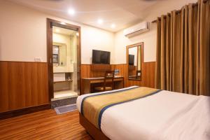 Letto o letti in una camera di Oasis Kathmandu Hotel