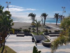 a view of a beach with a water slide at Chic Home with garage Almuñecar San Cristobal in Almuñécar