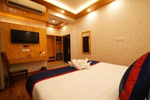 Voodi või voodid majutusasutuse Hotel Bella Heights toas