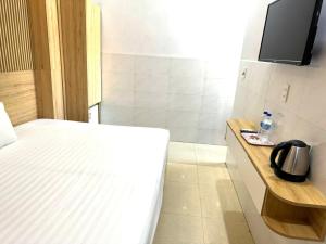 Postel nebo postele na pokoji v ubytování Thanh Hiền HB Hotel