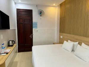 Postel nebo postele na pokoji v ubytování Thanh Hiền HB Hotel
