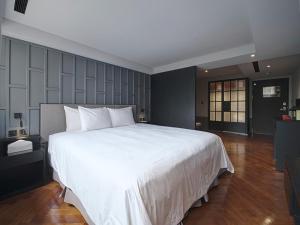 Letto o letti in una camera di Reddot Hotel