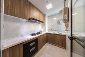 Cucina o angolo cottura di Excellence International Apartment - Convention & Exhibition Center