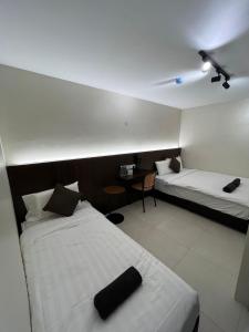 Kangsar KK Hotel客房内的一张或多张床位