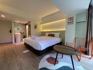 Postel nebo postele na pokoji v ubytování Gecko EYE Hotel
