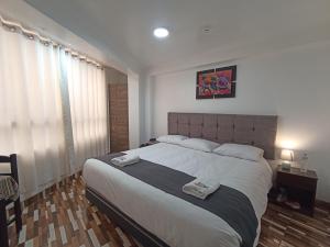 Postel nebo postele na pokoji v ubytování Templo Home