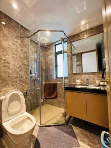a bathroom with a shower and a toilet and a sink at R&F Seine Region at ANJU in Johor Bahru +289 photos