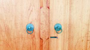 a wooden door with two blue knobs on it at Villa Mae Hong Son in Mae Hong Son +16 photos