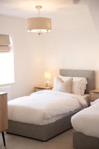 Lonsdale House Boutique Apartments客房内的一张或多张床位