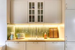 Kuchyň nebo kuchyňský kout v ubytování Les Brises Normandes - Maison à 4min de la plage + 8 fotografií