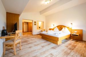 Łóżko lub łóżka w pokoju w obiekcie Hubengut Bed and Breakfast