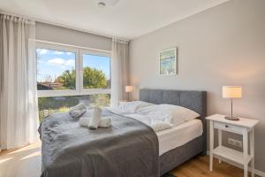 A bed or beds in a room at Vacation Home in Prater - Central, Garden and Sauna