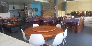 a dining room with a table and chairs at Dolphin Bay Resort Puerto Galera in San Isidro