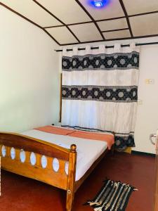 Ένα ή περισσότερα κρεβάτια σε δωμάτιο στο Raja Guest House