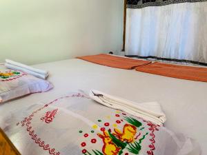 Ένα ή περισσότερα κρεβάτια σε δωμάτιο στο Raja Guest House