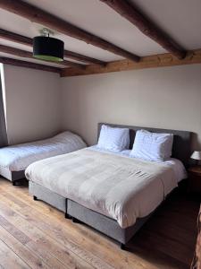 Postel nebo postele na pokoji v ubytování Buteo chambres d'hôtes & espresso