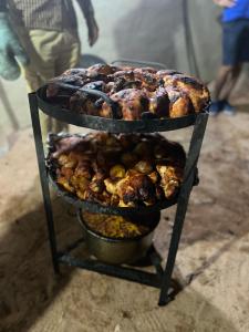 a stand with several different types of food on it at Moon rum 2 in Disah