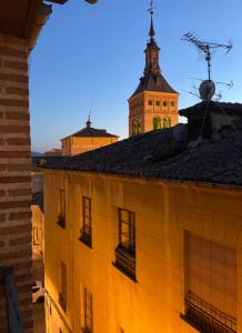 a view of a building with a clock tower at Sego Apartments III in Segovia