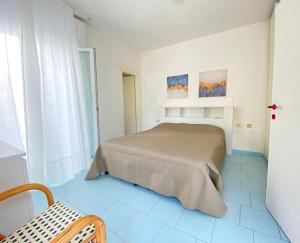 Ein Bett oder Betten in einem Zimmer der Unterkunft Hotel Lorenza B&B e Mini Suite