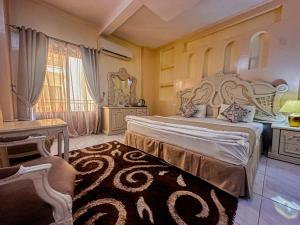 Postel nebo postele na pokoji v ubytování Riyam Hotel + 32 fotografií