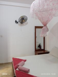 Postel nebo postele na pokoji v ubytování Pearl Deluna Resort Mirissa