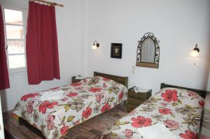 Posteľ alebo postele v izbe v ubytovaní Mirto Apartments