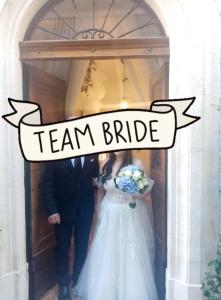 a bride and groom walking out of a door at A un passo dal castello in Pacentro