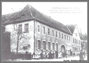 a group of people standing outside of a large building at Hotel Baeren in Leimen