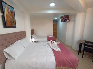 Postel nebo postele na pokoji v ubytování Templo Home