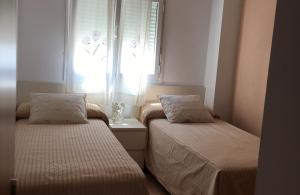 Posteľ alebo postele v izbe v ubytovaní Apartamento Mirador de Conil