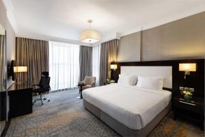 Letto o letti in una camera di Warwick Hotel Jeddah