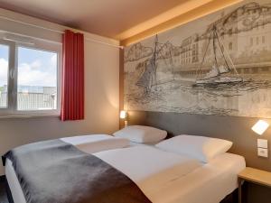 Postel nebo postele na pokoji v ubytování B&B Hotel Oldenburg