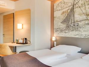 Postel nebo postele na pokoji v ubytování B&B Hotel Oldenburg