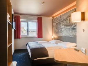 Postel nebo postele na pokoji v ubytování B&B Hotel Oldenburg