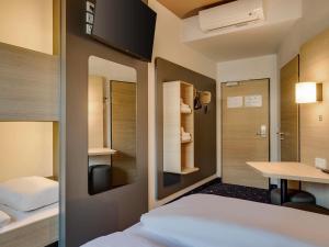 Postel nebo postele na pokoji v ubytování B&B Hotel Oldenburg
