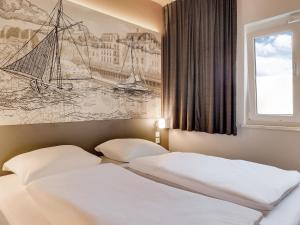 Postel nebo postele na pokoji v ubytování B&B Hotel Oldenburg