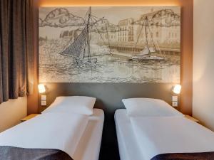 Postel nebo postele na pokoji v ubytování B&B Hotel Oldenburg