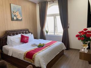 En eller flere senge i et værelse på Kim Chi An Hotel DL - by BAY LUXURY